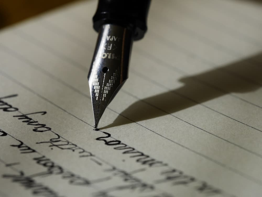 Structured STAR method notes, business metrics notebook, and pen on desk